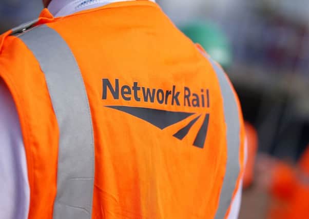 The Daily Telegraph said Transport Secretary Chris Grayling is preparing to tell the publicly-owned Network Rail that he wants it to share responsibility for running the tracks with the private operating companies. Credit: Jonathan Brady/PA Wire