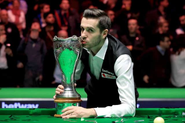 Mark Selby celebrates with the Betway UK Championship trophy after victory over Ronnie O'Sullivan at the York Barbican. Picture: Mike Egerton/PA.