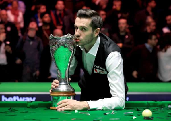 Mark Selby celebrates with the Betway UK Championship trophy after victory over Ronnie O'Sullivan at the York Barbican. Picture: Mike Egerton/PA.