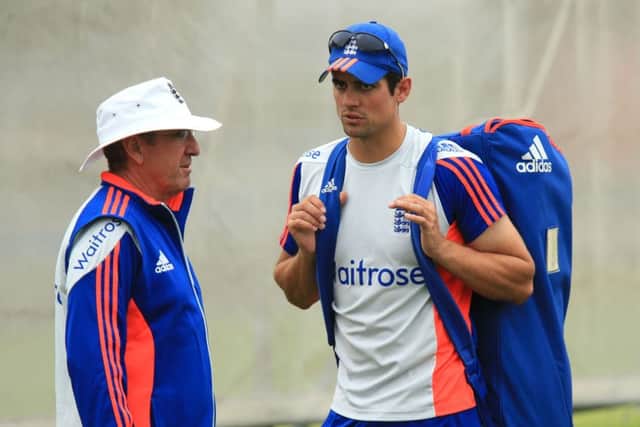England captain Alastair Cook chats with coach Trevor Bayliss. Picture: Mike Egerton/PA