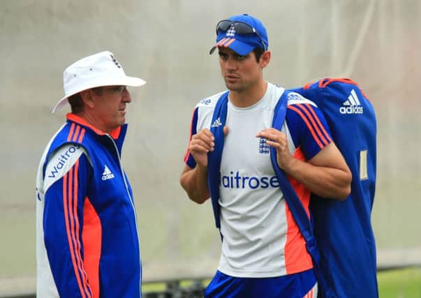 England captain Alastair Cook chats with coach Trevor Bayliss. Picture: Mike Egerton/PA