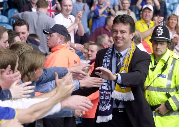 MAY 2002: David O'leary shakes hands with fans in the Kop after the final whistle.