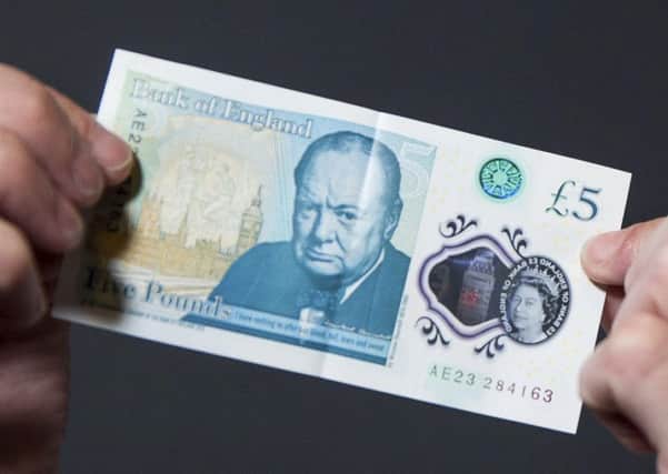 Brits are being urged to check their new fivers after engraved bank notes worth as much as Â£50,000 were circulated in a Willie Wonka-style 'Golden Ticket' giveaway.