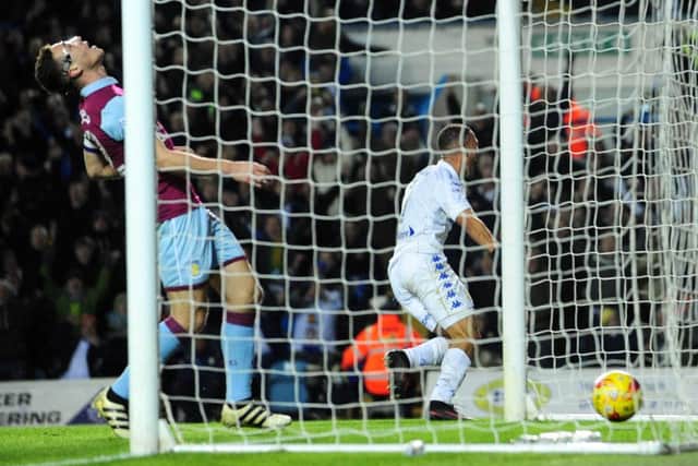 Kemar Roofe scores against Aston Villa.