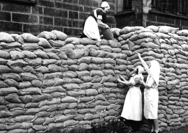 [1]
Morley Hall, Sandbags (Morley)
Black & White image	Undated, Photograph taken during the Second World War showing nurses building up sandbag protection to the outer walls of Morley Hall. Morley Hall was built by Thomas Dawson in 1683. In 1917 it was bought by Sir Charles Scarth and given to the town for a maternity home. This closed in 1972 and a preservation order was placed on the Hall in 1973. The grounds around the Hall became Scarth's Park.
[internal reference; 200323_63839358:MO 561]