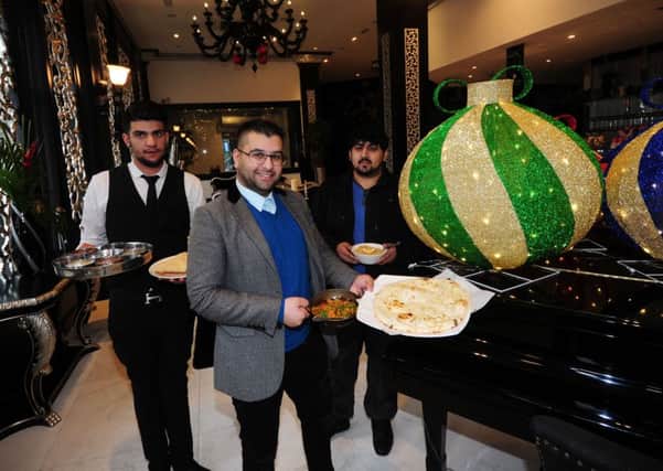 Mumtaz restaurant, Chadwick Street, Leeds, is putting on a fine dining meal for the homeless..Pictured from the left are Adam Hussain, Sajed Mahmood  and Danish Rayhan are pictured with the food....12th December 2016 ..Picture by Simon Hulme