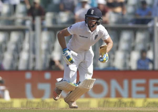 England's batsman Jos Buttler runs between the wickets on his way to scoring 76 on the second day in Mumbai. Picture: AP/Rafiq Maqbool