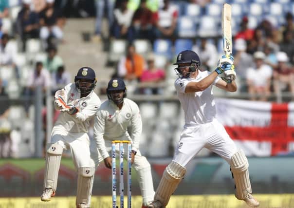 England's batsman Jos Buttler on his way to scoring 76 for England in Mumbai on Friday. Picture: AP/Rafiq Maqbool