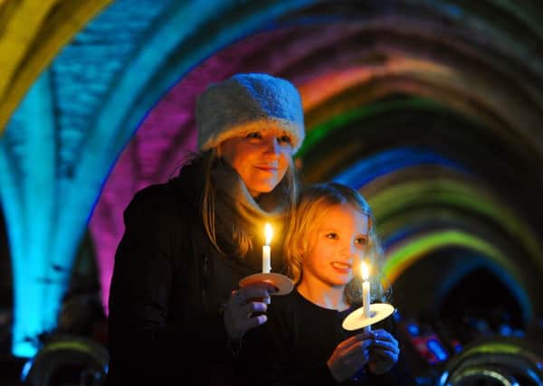 DECK THE HALLS: Jenna Pearcy with her daughter Ebony at Fountains Abbey near Ripon. PIC: Tony Johnson