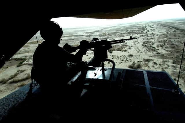 A helicopter carrying British troops in the Basra area of Iraq fly on a mission in 2006. (PA).