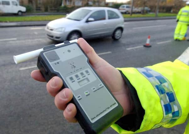 A motorist is stopped by drink-drive police.
Picture: John Giles/PA Wire