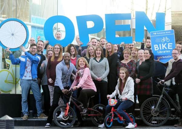 Yorkshire Bank employees getting behind the Yorkshire Bank Bike Libraries scheme at the companys headquarters in Leeds.