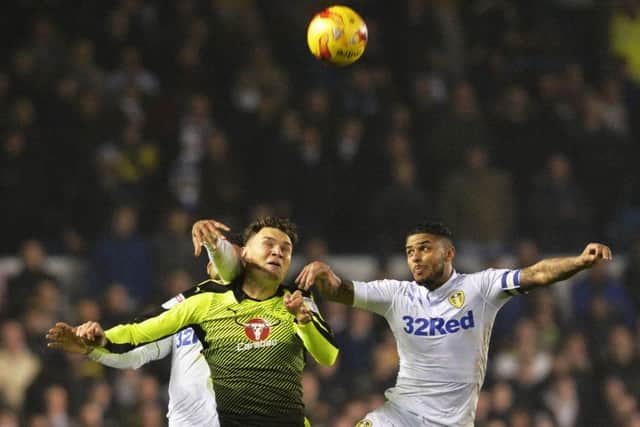 Liam Bridcutt challenges for a high ball against Reading. PIC: Bruce Rollinson