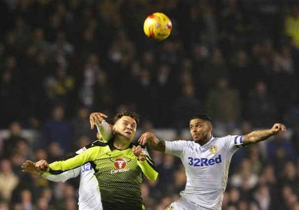 Liam Bridcutt challenges for a high ball against Reading. PIC: Bruce Rollinson