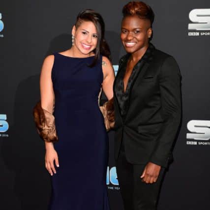 Nicola Adams and partner on the red carpet. Photo: Ian West/PA Wire