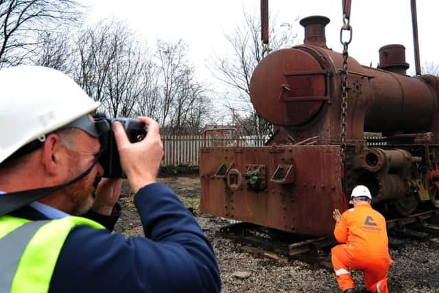 The team at Middleton Railway record the moment that Picton is lowered on to its new piece of track. Picture: Simon Hulme.