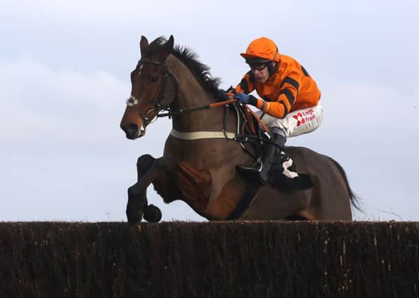 Thistlecrack and Tom Scudamore on the way to winning The bet365 Novices' Steeple Chase Race in November.