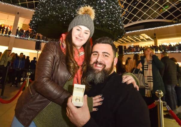 Andy Wormald, 29, and partner Lauren Berg, 25, from Pudsey, who got engaged under the Kissing Tree in Trinity Leeds.