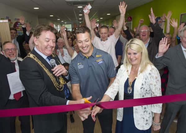 Leeds Rhinos star Danny McGuire does the honours at the centre's opening.