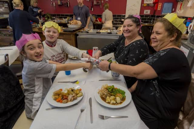 SCHOOL DINNERS: Scarlett Teahan, 9, Bobby Farquharson, 10, grandma Maria Casey and great auntie Bernadette Ramsden enjoy their lunch at Richmond Hill Primary School.