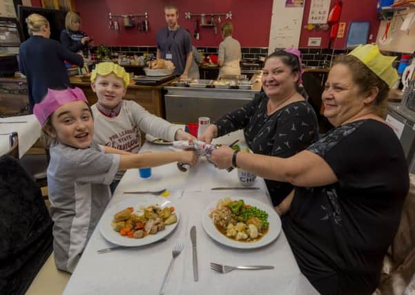 SCHOOL DINNERS: Scarlett Teahan, 9, Bobby Farquharson, 10, grandma Maria Casey and great auntie Bernadette Ramsden enjoy their lunch at Richmond Hill Primary School.