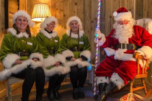 Santa and three of his helpers