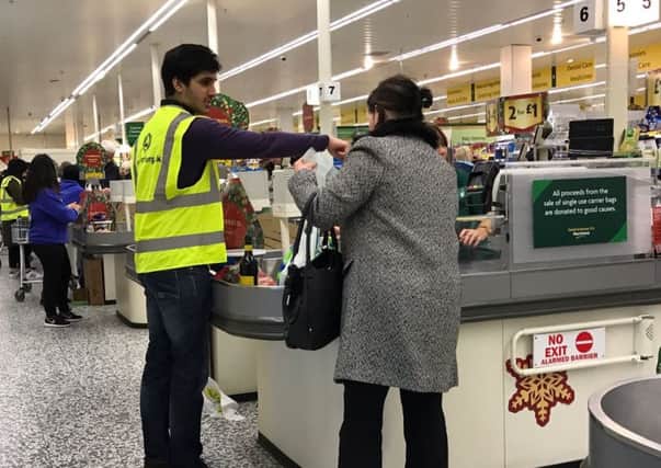 Volunteers helped customers with bag-packing.