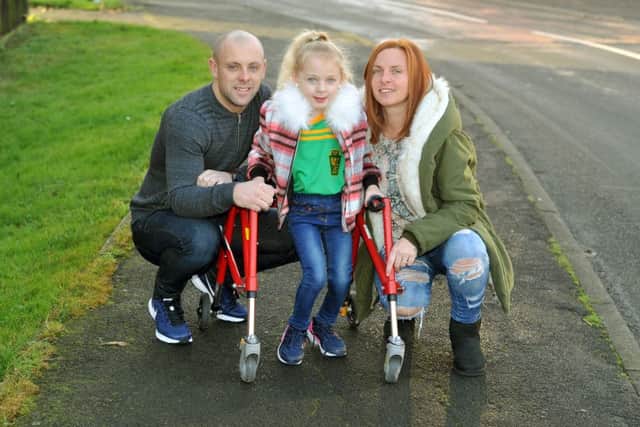 27 December 2016.......  Coopa Ellis-Adams, 5, with parents  Wayne and Louisa at home in Hunslet. The family is hoping to raise Â£35,000 for an operation at the LGI for her to be able to walk unaided after she was diagnosed with cerebral palsy. Presently she requires the use of a wheelchair or walking frame as the condition mainly affects her legs. Picture Tony Johnson.