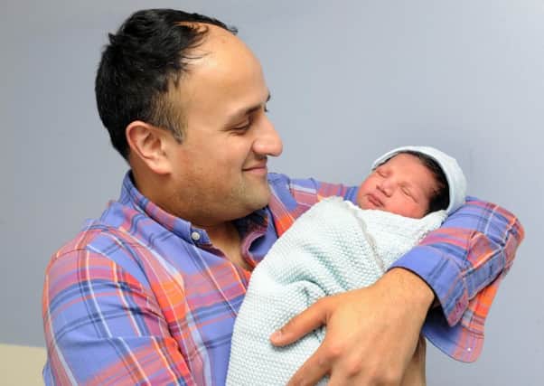 Proud dad Fahn Khan with baby Baha, the first baby born in St James's Hospital  on New Year's Day 2017