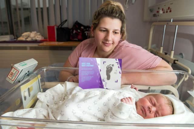 Charlotte Marshall with her new born baby Lincoln who is part of a Hull City of Culture artwork
