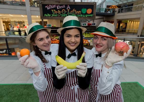 HEALTHY: Pictured handing out the fruit and vegetables, left to right, are Beth Donkin, Raj Takhar and Sophia Austen-Meek.