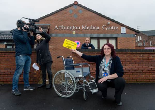 Liz Scott, practice manager at Arthington Medical Centre, being filmed by BBC's The One Show (left to right) (Cameraman) Mark Bentele, (Producer) Annaliese Edwards, and The One Show Presenter Kevin Duala.