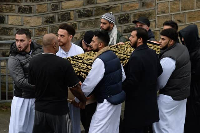 The coffin of Mohammed Yassar Yaqub is carried towards Masjid Bilal Huddersfield where prayers are being held ahead of his funeral.