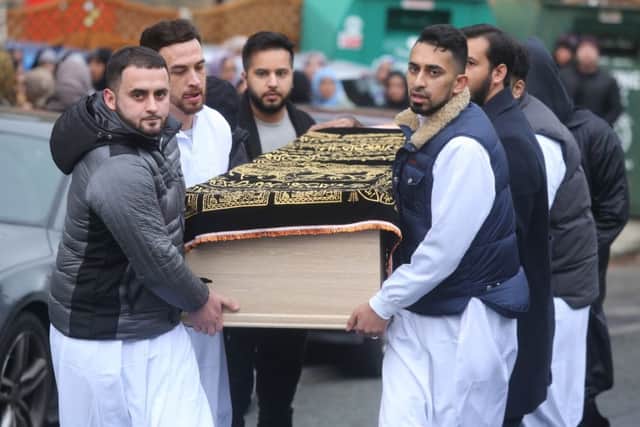Men carry the coffin of Yassar Yaqub into the Masjid Bilal mosque in Huddersfield. Picture: Ross Parry Agency