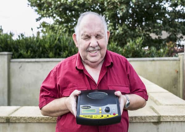 John Baines, who is totally blind, with his Sonata Plus+ internet radio from British Wireless.