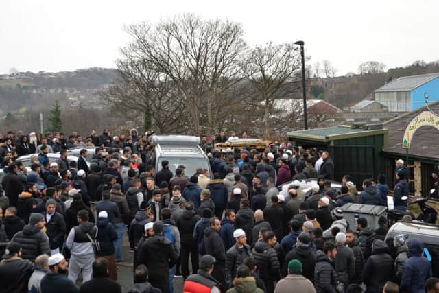 The coffin of Mohammed Yassar Yaqub is carried outside Masjid Bilal Huddersfield where prayers are being held ahead of his funeral.