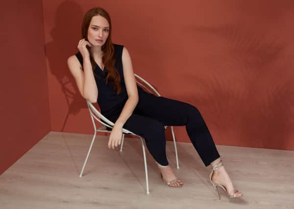 A simple all-in-one with tie front can be worn alone with heels for night, with pumps and a tee for weekends and with jacket and boots for work. Antwerp jumpsuit, Â£149, from Fenn Wright Manson.