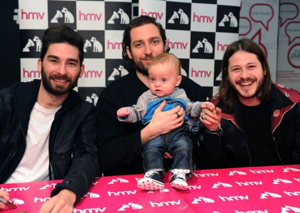 Seven month old Olly Seabourne meets You Me At Six at HMV in Leeds. PIC: Jonathan Gawthorpe