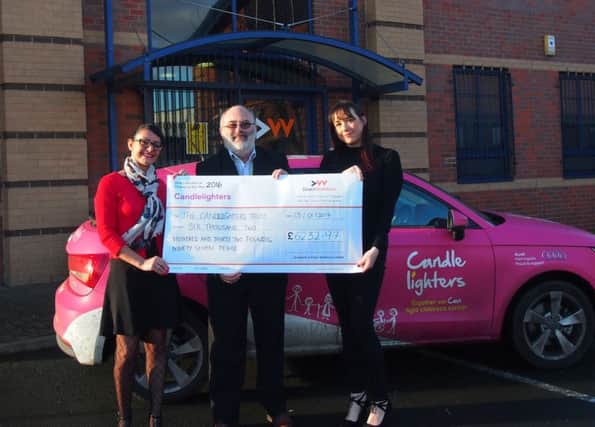 CHEQUE IT OUT: Candlelighters receive the cheque from Direct Workforce.