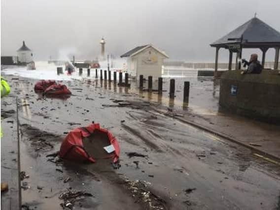 Waves leave debris on Pier Road. Picture by Ceri Oakes