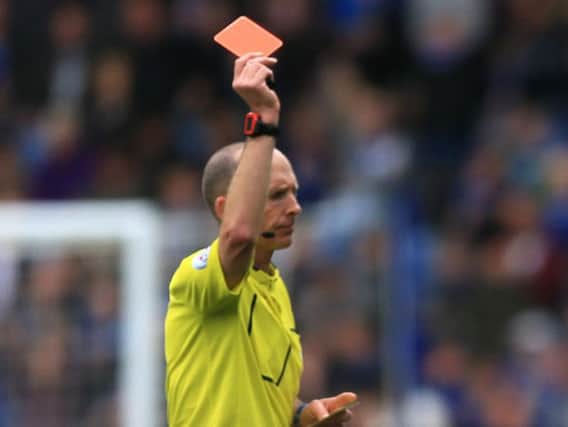 Mike Dean made the headlines for the wrong reasons after sending West Ham's Sofiane Feghouli off in December (Photo: PA)