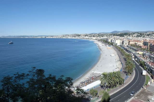 View of the famed Promenade des Anglais, scene of the truck attack, in Nice, southern France, Friday, July 15, 2016. A large truck mowed through revelers gathered for Bastille Day fireworks in Nice, killing more than 80 people and sending people fleeing into the sea as it bore down for more than a mile along the Riviera city's famed waterfront promenade. (AP Photo/Christian Alminana)