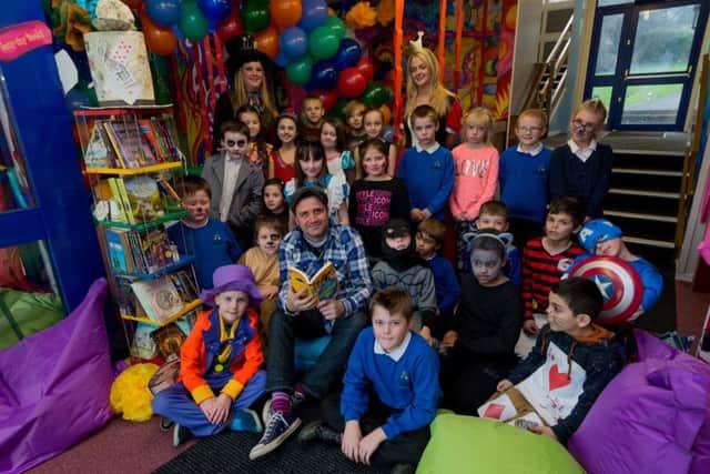 READING HUB: Author Phil Earl with Ryecroft Academy pupils in their new reading hub.
