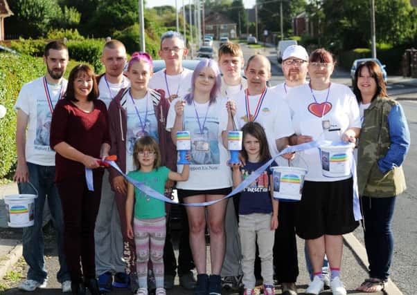 Carrie Curtis (centre) is pictured with family and friends on a charity walk. Picture by Simon Hulme