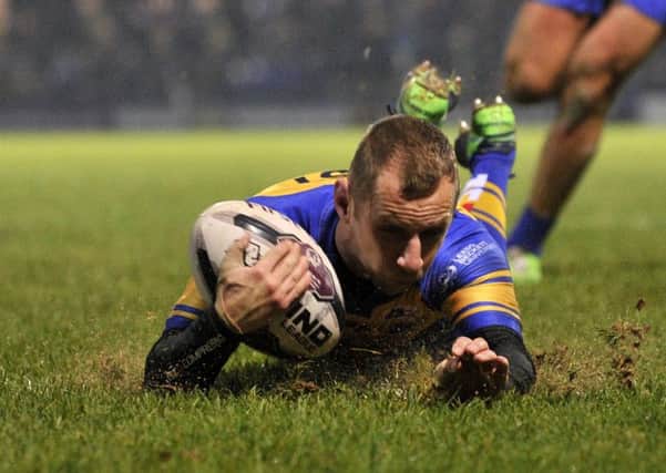 Rob Burrow dives in for the Rhinos' second try in the Ryan Hall Testimonial win over Hull KR. PIC: Bruce Rollinson