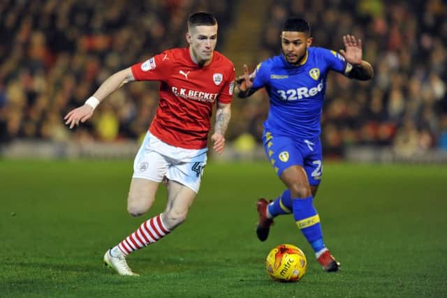 Leeds United captain Liam Bridcutt hangs off
Tyke's Ryan Kent. PIC: Tony Johnson