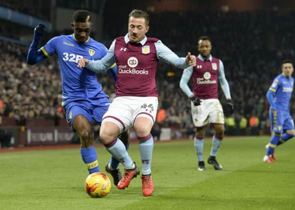 Hadi Sacko is held off the ball by Ross McCormack.
 PIC: Bruce Rollinson