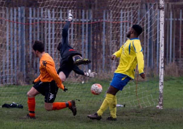 JB Celtic's Matty Dalton claims the ball crossed the line but the referee reckoned Seacroft WMC goalkeeper Ben Hunter had stopped it. PIC: James Hardisty