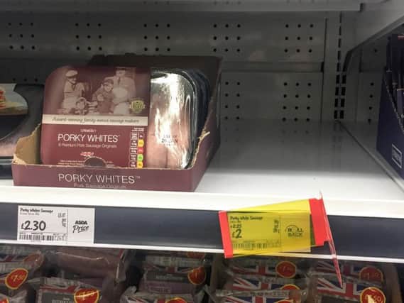 A empty shelf of sold out Porky Lights sausages