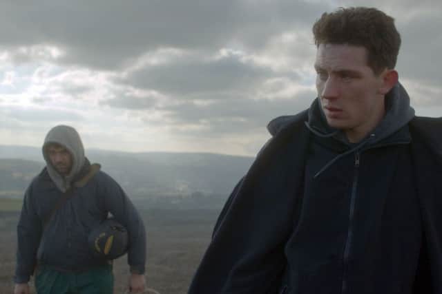 Alec Secareanu as Gheorghe Ionescu and Josh O'Connor as Johnny Saxby in God's Own Country.